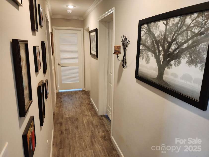 583 Cane Branch Road, Burnsville, NC 28714.  MLS# CAR4251066, YatesRealty ID 15423. Hallway from dining area to rear of the house