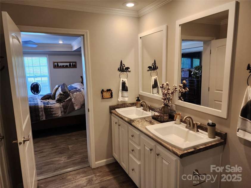 583 Cane Branch Road, Burnsville, NC 28714.  MLS# CAR4251066, YatesRealty ID 15423. Primary bath dual sinks