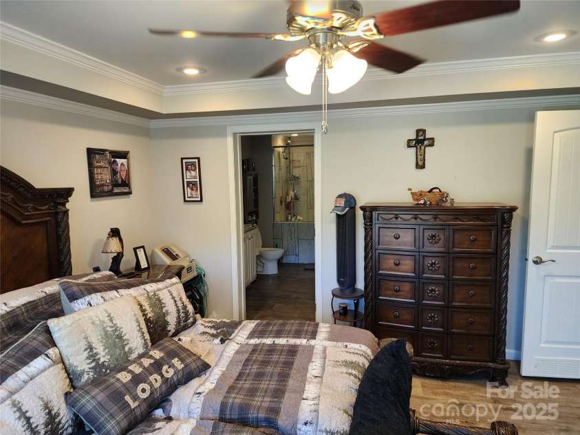 583 Cane Branch Road, Burnsville, NC 28714.  MLS# CAR4251066, YatesRealty ID 15423. Primary bedroom showing door to on suite bath.