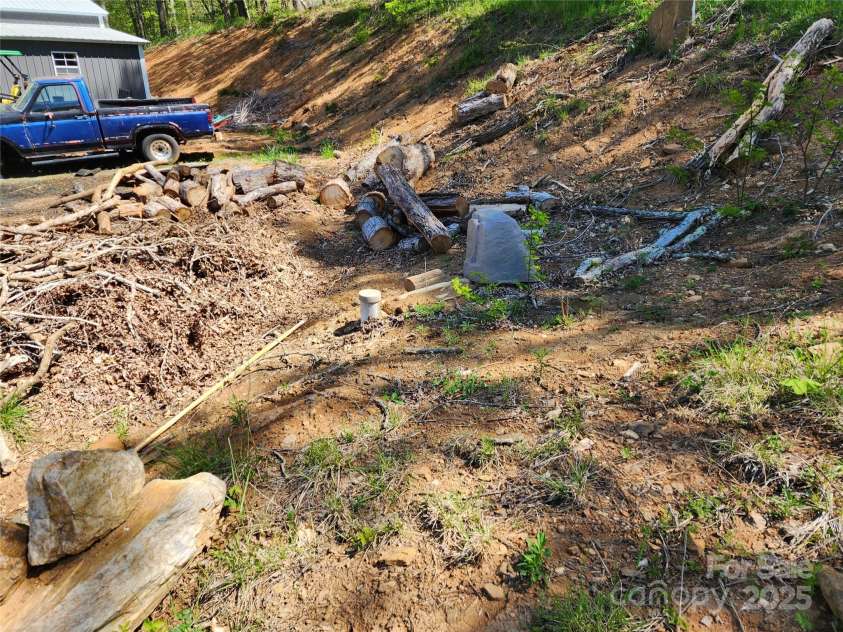 583 Cane Branch Road, Burnsville, NC 28714.  MLS# CAR4251066, YatesRealty ID 15423. Well and RV hookups