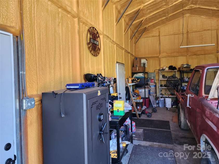 583 Cane Branch Road, Burnsville, NC 28714.  MLS# CAR4251066, YatesRealty ID 15423. Workshop attached to garage