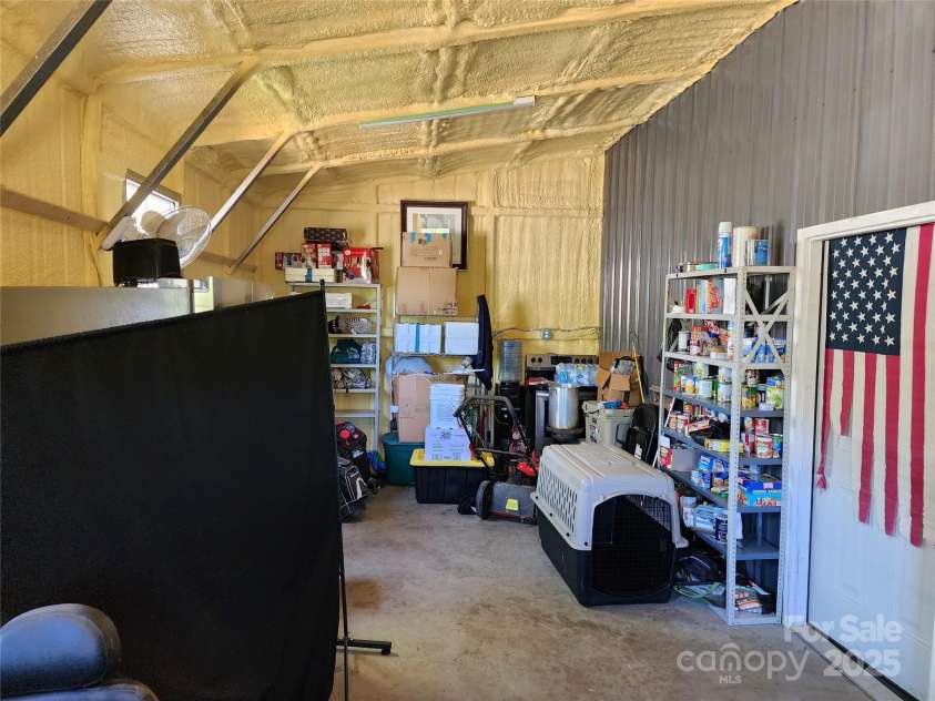 583 Cane Branch Road, Burnsville, NC 28714.  MLS# CAR4251066, YatesRealty ID 15423. Workshop attached to garage