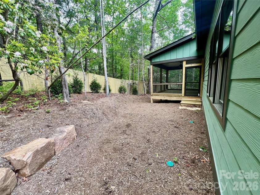 397 Soquili Drive, Brevard, NC 28712.  MLS# CAR4206304, YatesRealty ID 1543. Back Yard
