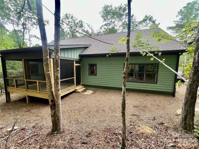 397 Soquili Drive, Brevard, NC 28712.  MLS# CAR4206304, YatesRealty ID 1543. Rear Screened Porch