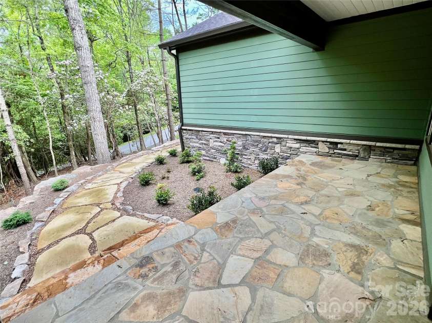 397 Soquili Drive, Brevard, NC 28712.  MLS# CAR4206304, YatesRealty ID 1543. Rocking chair Front Porch