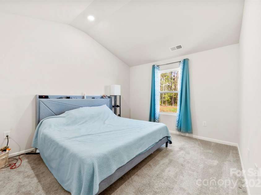3118 Maple Ridge Drive, Gastonia, NC 28052.  MLS# CAR4243632, YatesRealty ID 15433. Bedroom with vaulted ceilings