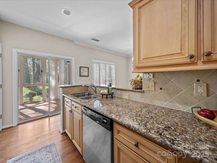 18758 Silver Quay Drive, Cornelius, NC 28031.  MLS# CAR4238668, YatesRealty ID 15441. Kitchen Overlooks Private Back Porch & Patio