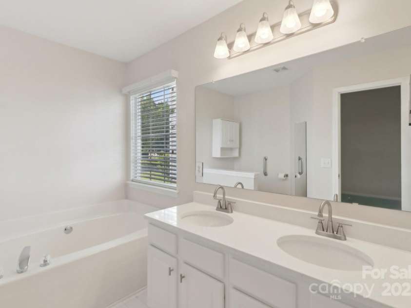 6724 Long Nook Lane, Indian Trail, NC 28079.  MLS# CAR4252483, YatesRealty ID 15442. Primary Bathroom. New Quartz Countertops & Fixtures.