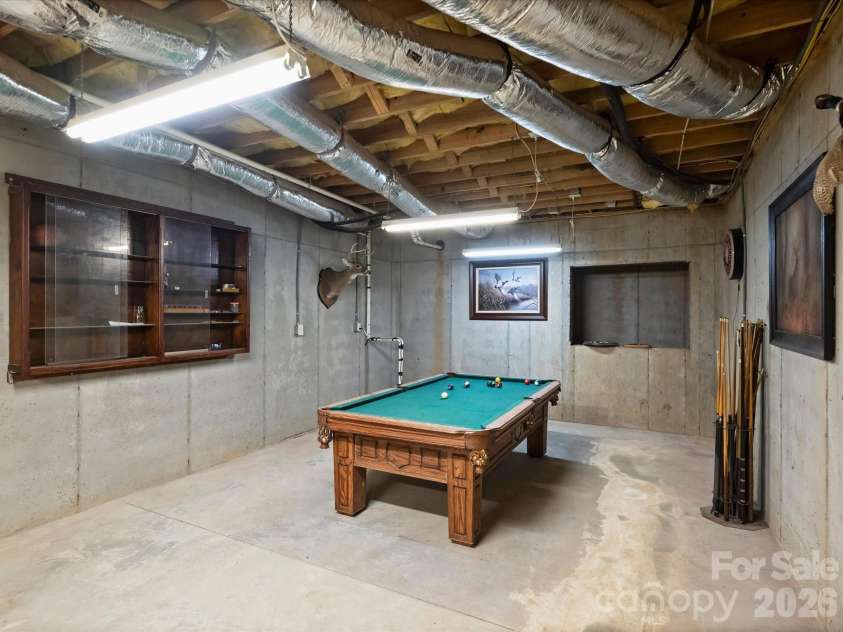 242 Hillside Avenue, Charlotte, NC 28209.  MLS# CAR4371887, YatesRealty ID 15455. High ceiling basement for gym or games