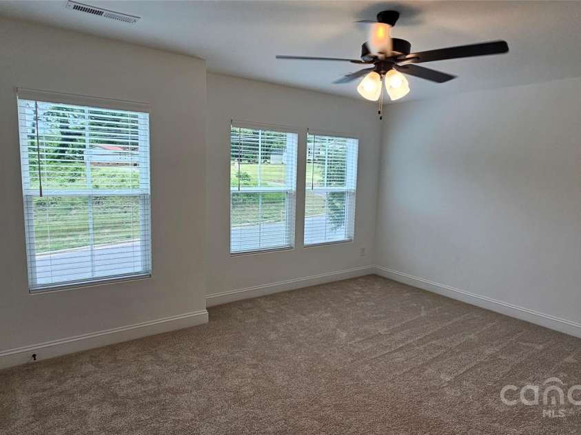 382 Moore Avenue, Mooresville, NC 28115.  MLS# CAR4255955, YatesRealty ID 15461. Unit A primary bedroom