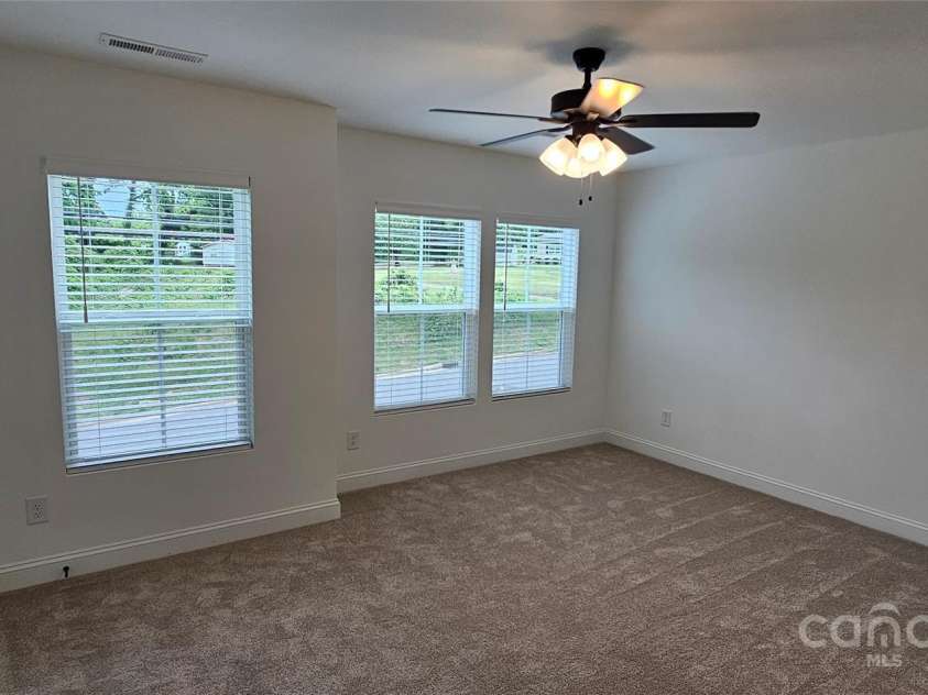 382 Moore Avenue, Mooresville, NC 28115.  MLS# CAR4255955, YatesRealty ID 15461. Unit B primary bedroom