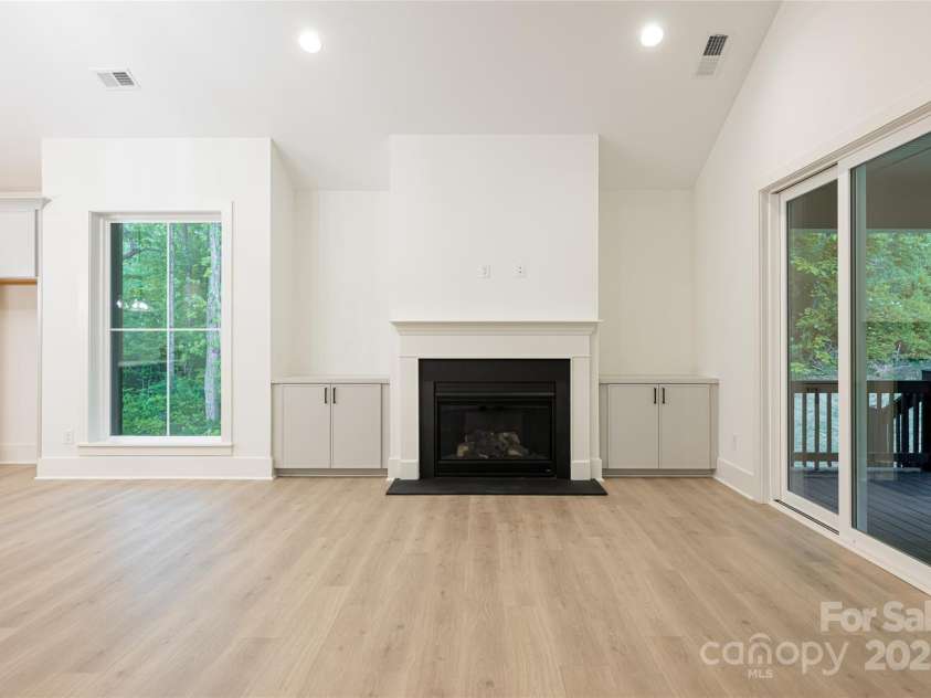 15 Maggies Lane, Asheville, NC 28803.  MLS# CAR4183002, YatesRealty ID 15463. Gas fireplace with built in cabinetry in the living room