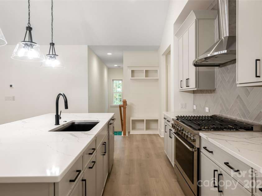 15 Maggies Lane, Asheville, NC 28803.  MLS# CAR4183002, YatesRealty ID 15463. The kitchen centers around a large island