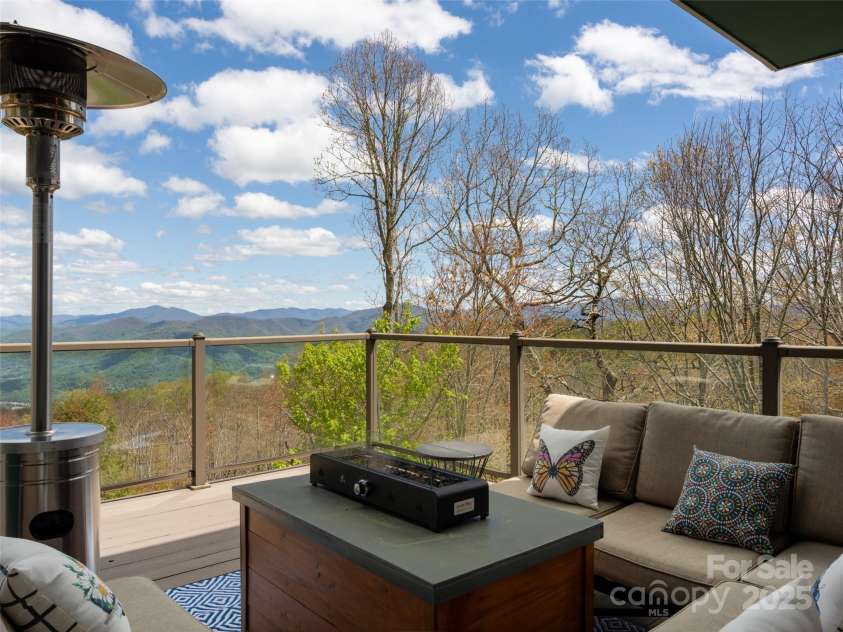 4344 Eagles Nest Road, Waynesville, NC 28786.  MLS# CAR4261425, YatesRealty ID 15485. DECK SEATING OUTSIDE DINING AREA