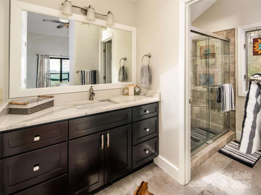4344 Eagles Nest Road, Waynesville, NC 28786.  MLS# CAR4261425, YatesRealty ID 15485. ENSUITE BATHROOM WITH SHOWER
