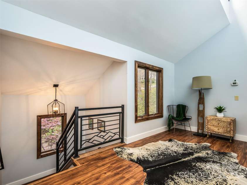 4344 Eagles Nest Road, Waynesville, NC 28786.  MLS# CAR4261425, YatesRealty ID 15485. UPPER LEVEL SITTING ROOM