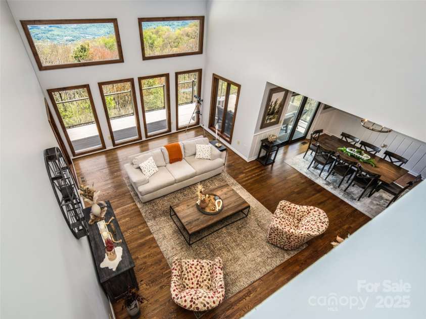 4344 Eagles Nest Road, Waynesville, NC 28786.  MLS# CAR4261425, YatesRealty ID 15485. UPPER LEVEL VIEW OF LIVING ROOM-HEART OF THE HOME