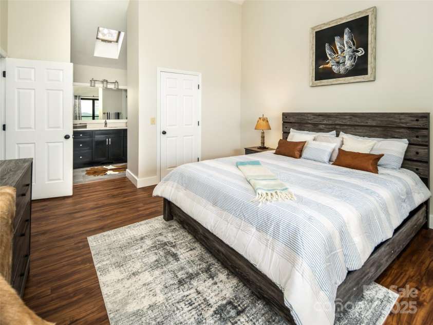 4344 Eagles Nest Road, Waynesville, NC 28786.  MLS# CAR4261425, YatesRealty ID 15485. VIEW OF ENSUITE BATHROOM WITH SKYLIGHT