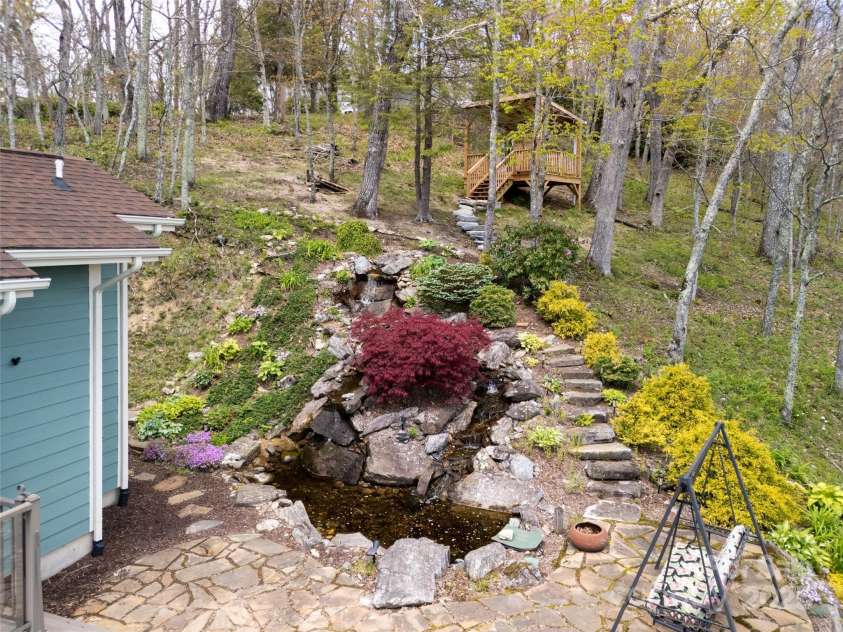 4344 Eagles Nest Road, Waynesville, NC 28786.  MLS# CAR4261425, YatesRealty ID 15485. WATERFALL FEATURE AND FLAGSTONE PATIO