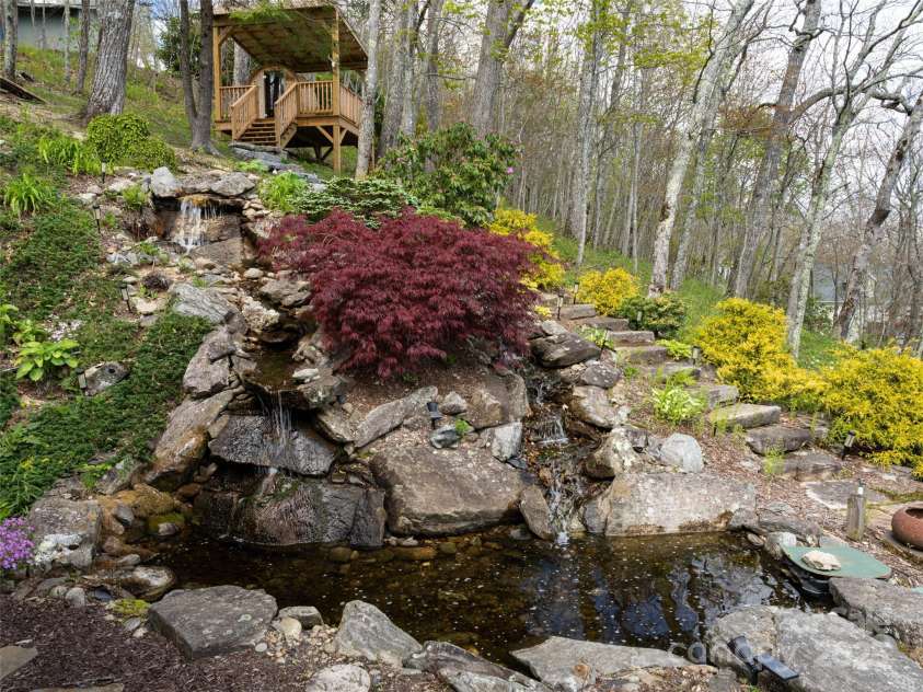 4344 Eagles Nest Road, Waynesville, NC 28786.  MLS# CAR4261425, YatesRealty ID 15485. WATERFALL FEATURE WITH STONE PATH TO SAUNA