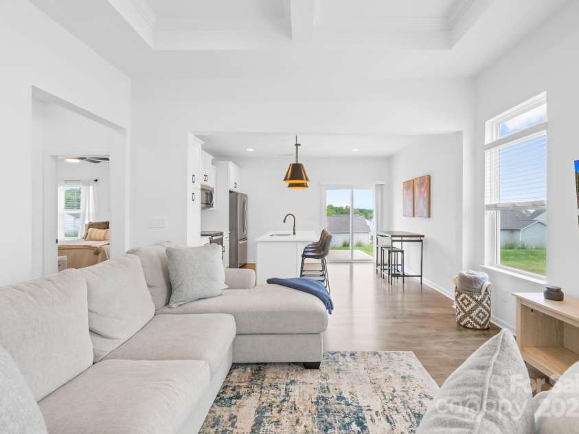 130 Slalom Street, Statesville, NC 28677.  MLS# CAR4264006, YatesRealty ID 15492. Another view of living room and kitchen