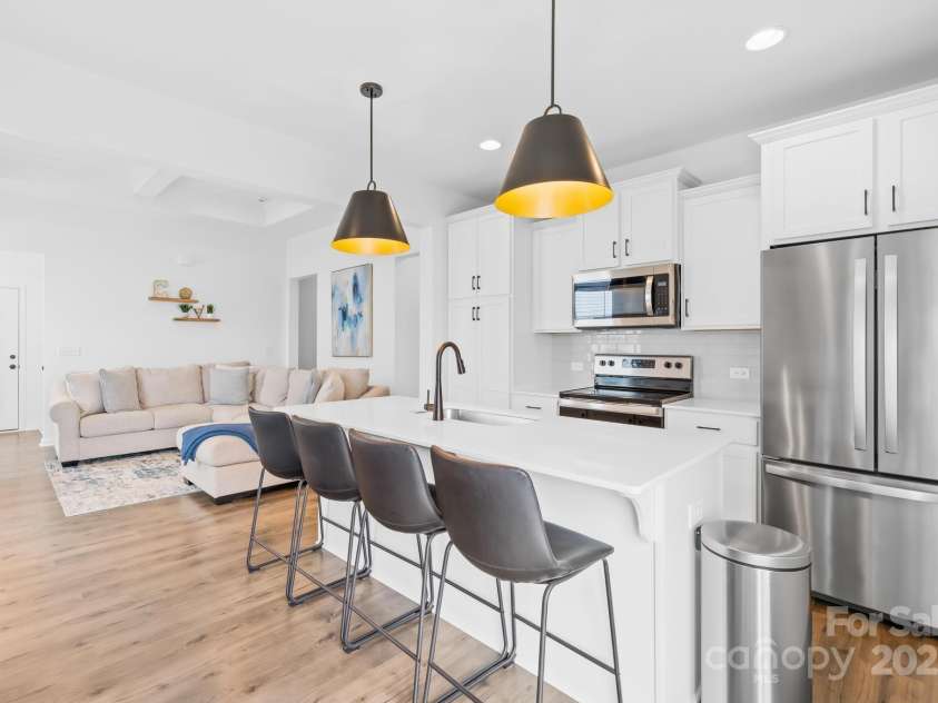 130 Slalom Street, Statesville, NC 28677.  MLS# CAR4264006, YatesRealty ID 15492. Kitchen island with ample sitting and pendant lighting