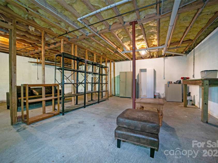 261 Franks Cove Road, Brevard, NC 28712.  MLS# CAR4263831, YatesRealty ID 15496. Large Basement/Garage Area