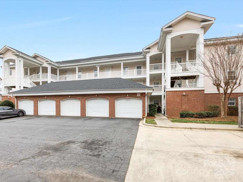 8759 Coralbell Lane, Charlotte, NC 28213.  MLS# CAR4231627, YatesRealty ID 15506. Garage on right belongs to this unit