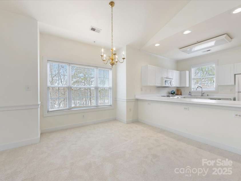 8759 Coralbell Lane, Charlotte, NC 28213.  MLS# CAR4231627, YatesRealty ID 15506. Large windows overlooking greenspace