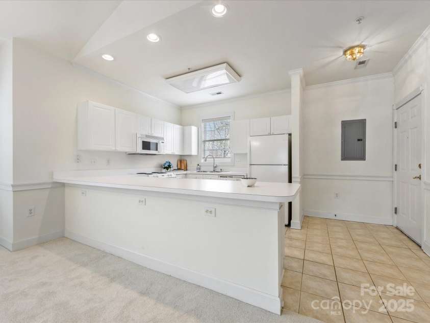 8759 Coralbell Lane, Charlotte, NC 28213.  MLS# CAR4231627, YatesRealty ID 15506. Nice bar seating area