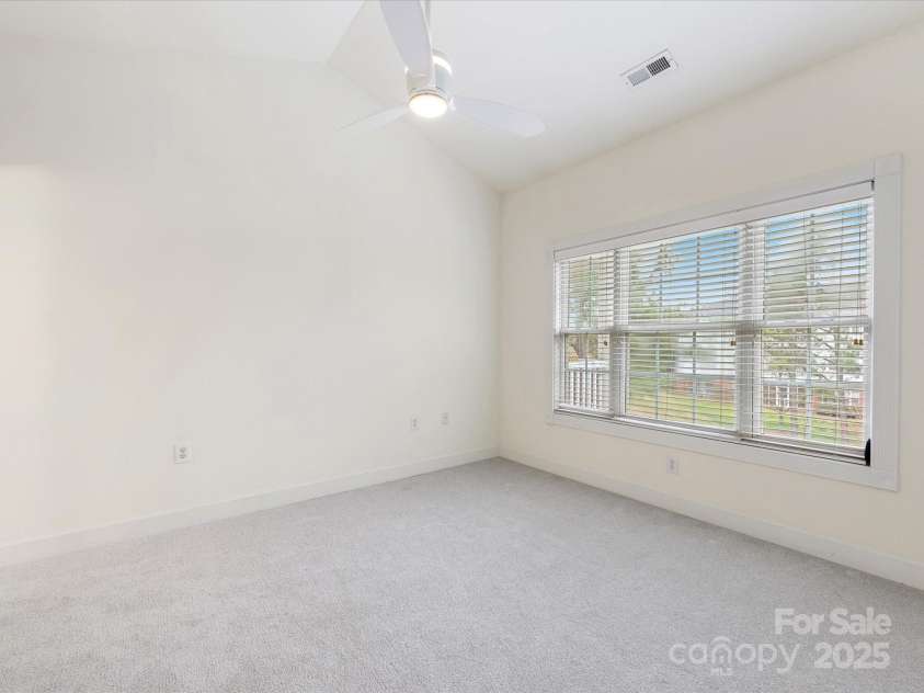 8759 Coralbell Lane, Charlotte, NC 28213.  MLS# CAR4231627, YatesRealty ID 15506. Primary bedroom with large windows