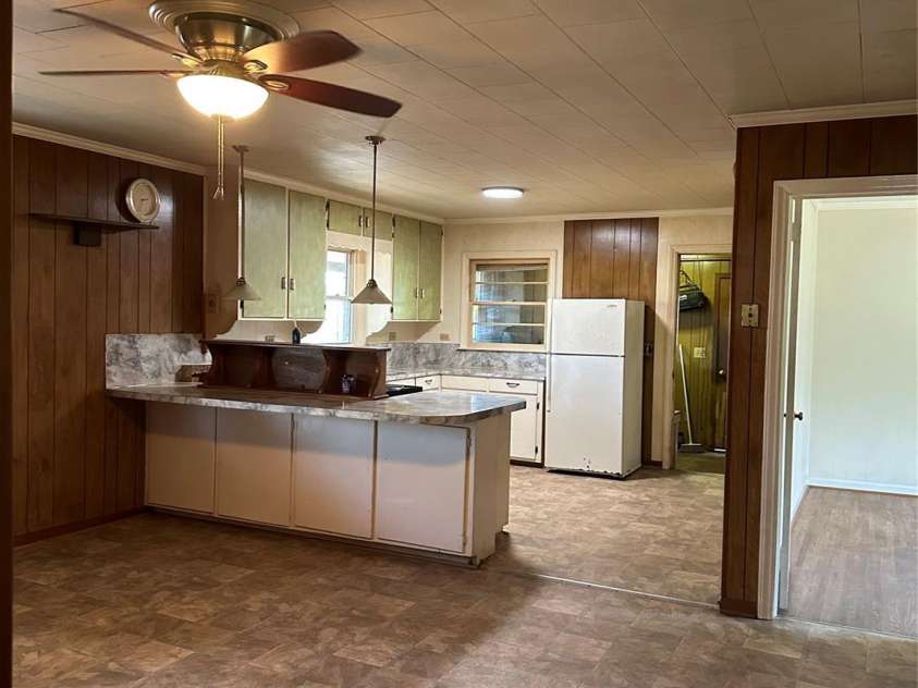 8245 Smith Road, Stanfield, NC 28163.  MLS# CAR4357357, YatesRealty ID 15507. Kitchen-Dining-Den