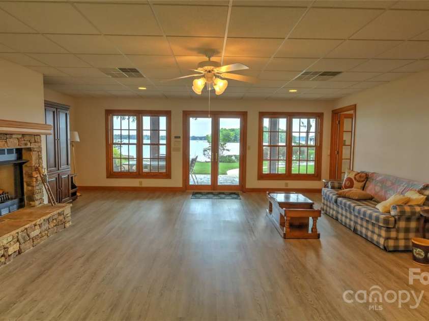 495 Bay Harbour Road, Mooresville, NC 28117.  MLS# CAR4256426, YatesRealty ID 15514. Basement great room with huge views, fireplace and kitchenette