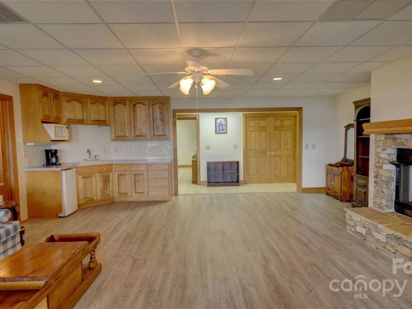 495 Bay Harbour Road, Mooresville, NC 28117.  MLS# CAR4256426, YatesRealty ID 15514. Basement great room with huge views, fireplace and kitchenette