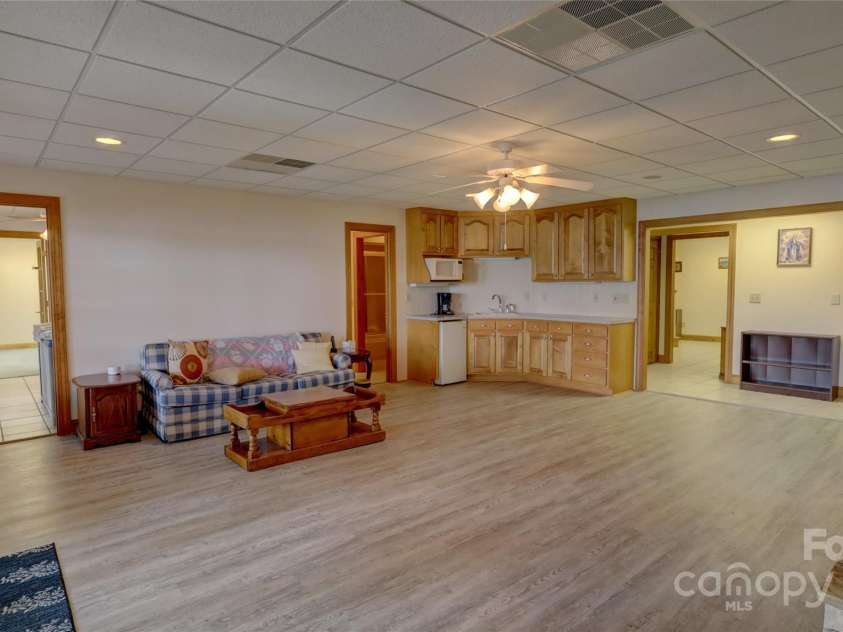 495 Bay Harbour Road, Mooresville, NC 28117.  MLS# CAR4256426, YatesRealty ID 15514. Basement great room with huge views, fireplace and kitchenette