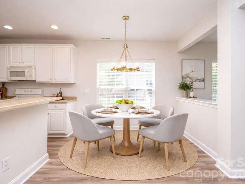 1325 Linden Glen Drive, Matthews, NC 28104.  MLS# CAR4370381, YatesRealty ID 15517. Breakfast area has new light fixture.  This room has been virtually staged.  