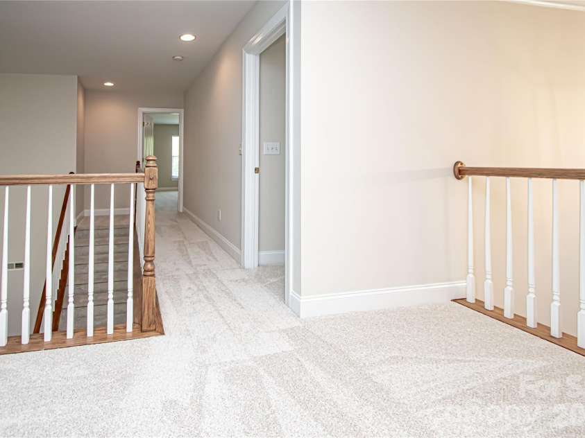 1325 Linden Glen Drive, Matthews, NC 28104.  MLS# CAR4370381, YatesRealty ID 15517. Hallway in upper level.  All new carpet in upper level.  