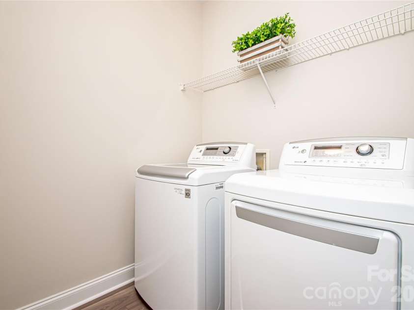 1325 Linden Glen Drive, Matthews, NC 28104.  MLS# CAR4370381, YatesRealty ID 15517. Laundry room conveniently located on the main level