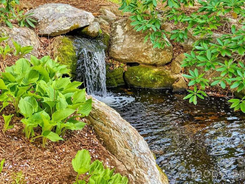 257 Jones Cove Road, Asheville, NC 28805.  MLS# CAR4368616, YatesRealty ID 15520. Artificial Waterfall