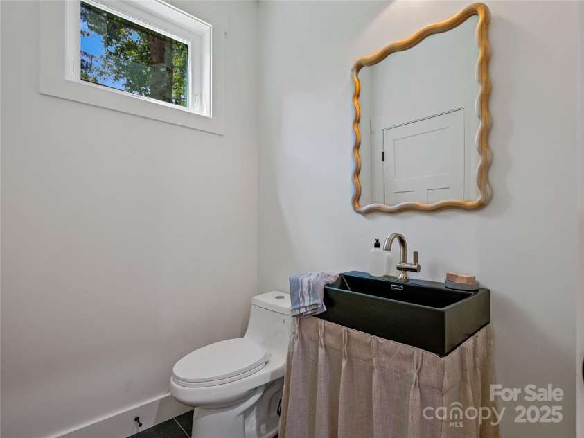 13 Pinecrest Drive, Asheville, NC 28803.  MLS# CAR4260113, YatesRealty ID 15521. Half bath with large storage closet