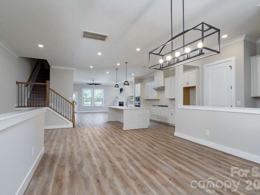 15132 Rocky Bluff Loop, Davidson, NC 28036.  MLS# CAR4351498, YatesRealty ID 15525. Open kitchen, dining, and llving