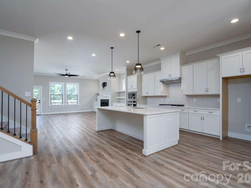 15132 Rocky Bluff Loop, Davidson, NC 28036.  MLS# CAR4351498, YatesRealty ID 15525. Oversized quartz covered kitchen island