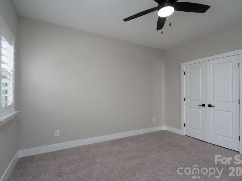 15132 Rocky Bluff Loop, Davidson, NC 28036.  MLS# CAR4351498, YatesRealty ID 15525. Secondary Bedroom walk in closet