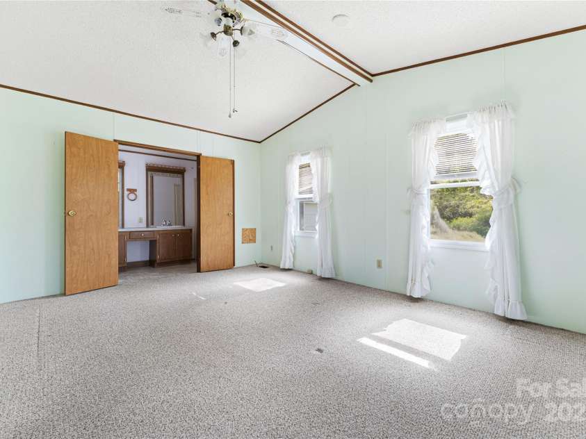 112 Melody Street, Clyde, NC 28721.  MLS# CAR4301909, YatesRealty ID 15527. Primary Bedroom