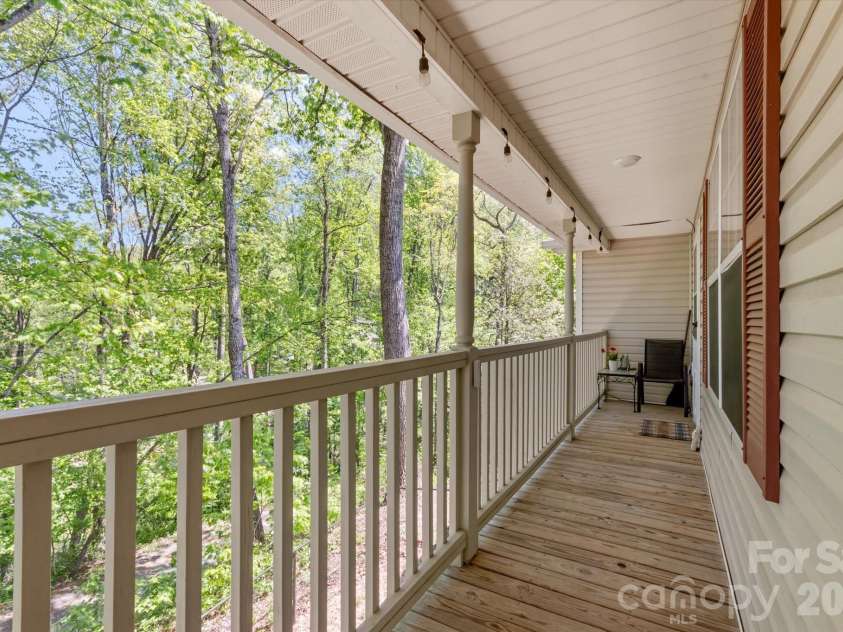 12 Hutchinson Woods, Fletcher, NC 28732.  MLS# CAR4374145, YatesRealty ID 15529. Covered deck in front