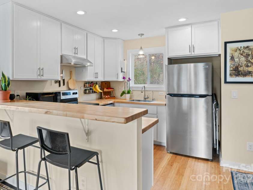 366 State Street, Asheville, NC 28806.  MLS# CAR4205001, YatesRealty ID 15530. Bar Height in a light bright kitchen