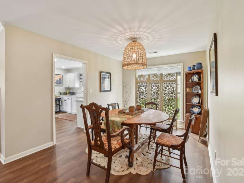 36 Planters Creek Road, Fletcher, NC 28732.  MLS# CAR4257762, YatesRealty ID 15540. The seamless flow into the dining area enhances the home's open and airy layout