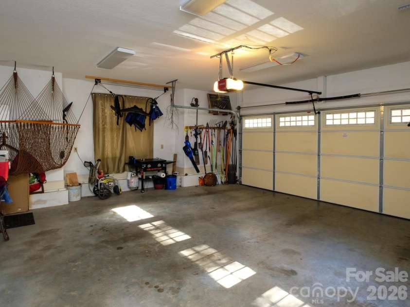 674 Soquili Drive, Brevard, NC 28712.  MLS# CAR4352829, YatesRealty ID 15540. 2 car garage with some built in storage