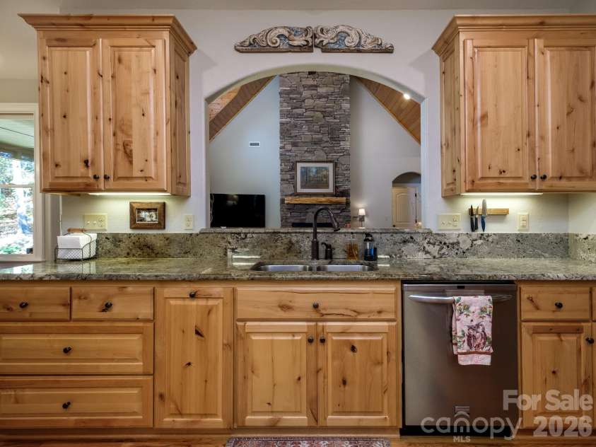 674 Soquili Drive, Brevard, NC 28712.  MLS# CAR4352829, YatesRealty ID 15540. Custom Kitchen is full of storage in a user friendly organization style.