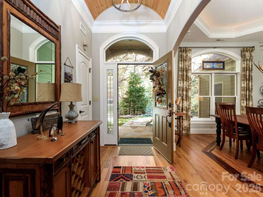 674 Soquili Drive, Brevard, NC 28712.  MLS# CAR4352829, YatesRealty ID 15540. Front entry with a wood barrel ceiling
